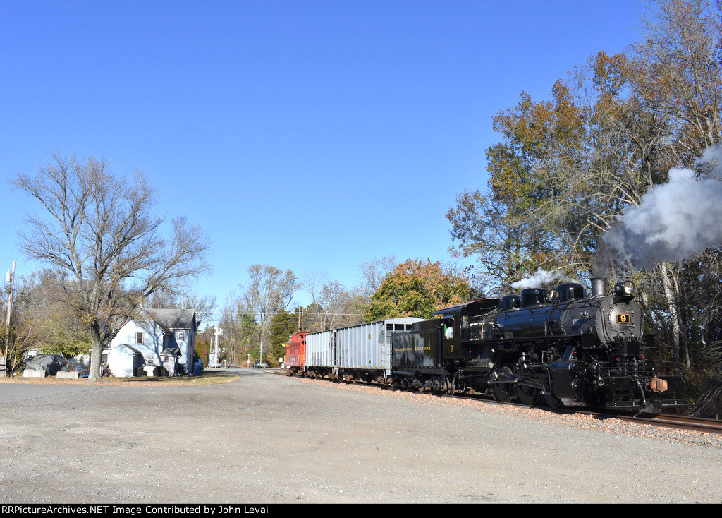 The steam photo charter backs toward Bailey St 